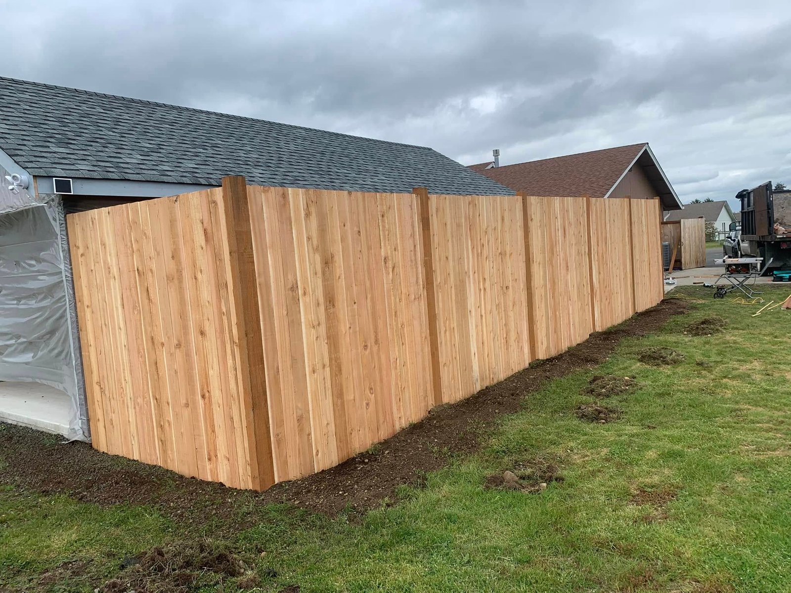Cedar privacy fence along a backyard property line